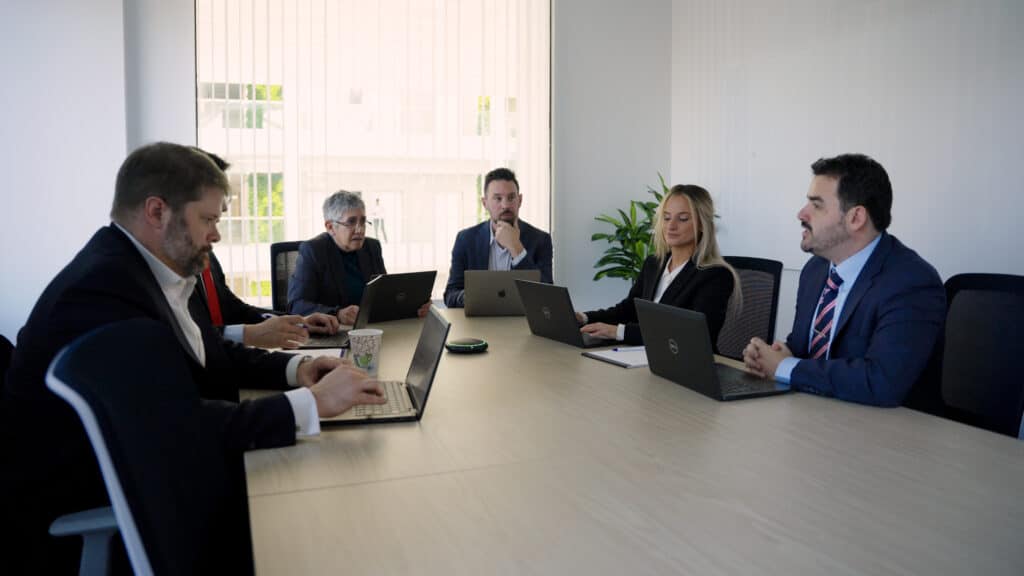 SSDI advocates sitting around a large conference room table