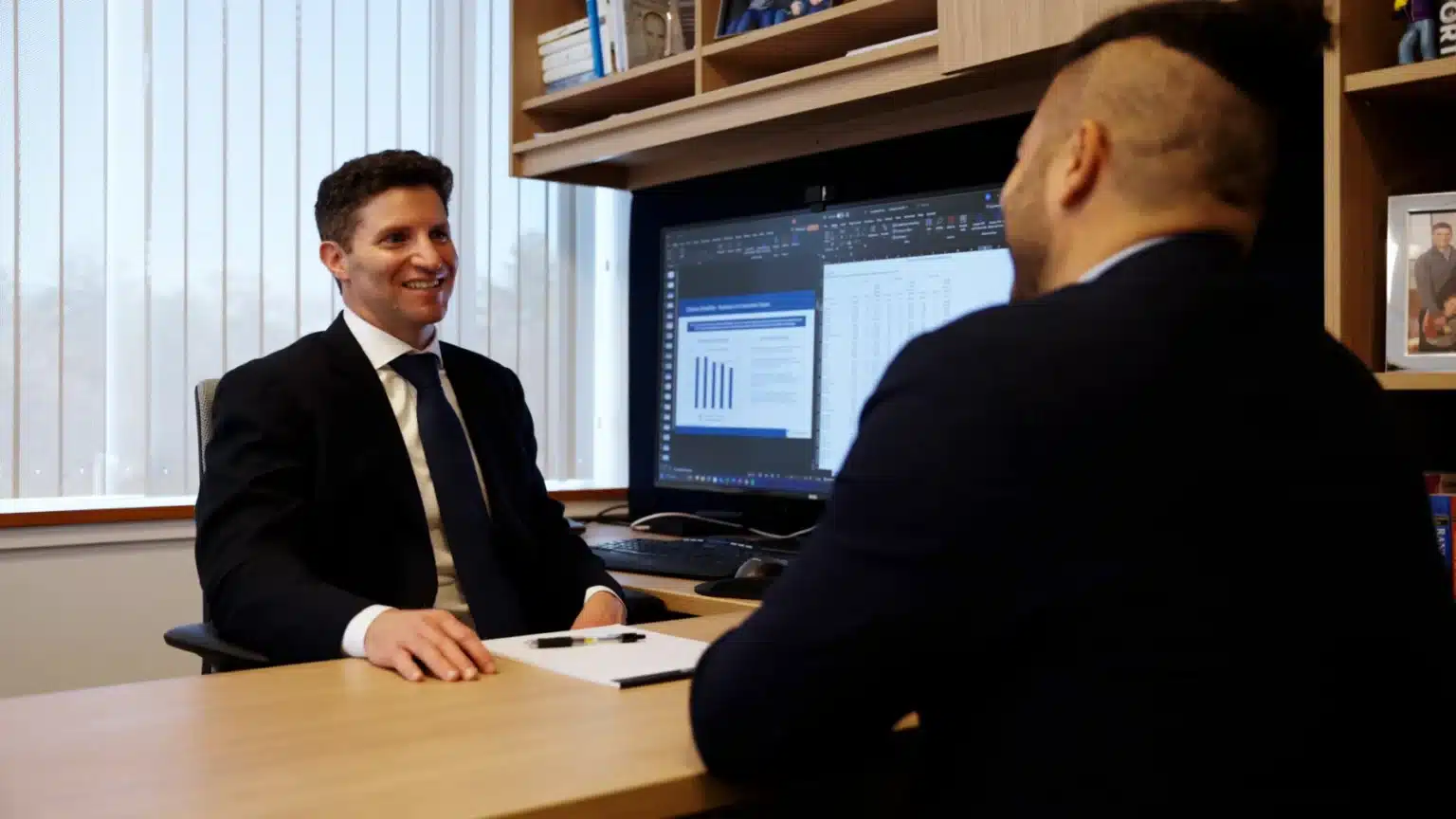 Attorney meeting in his office with client about potential claim